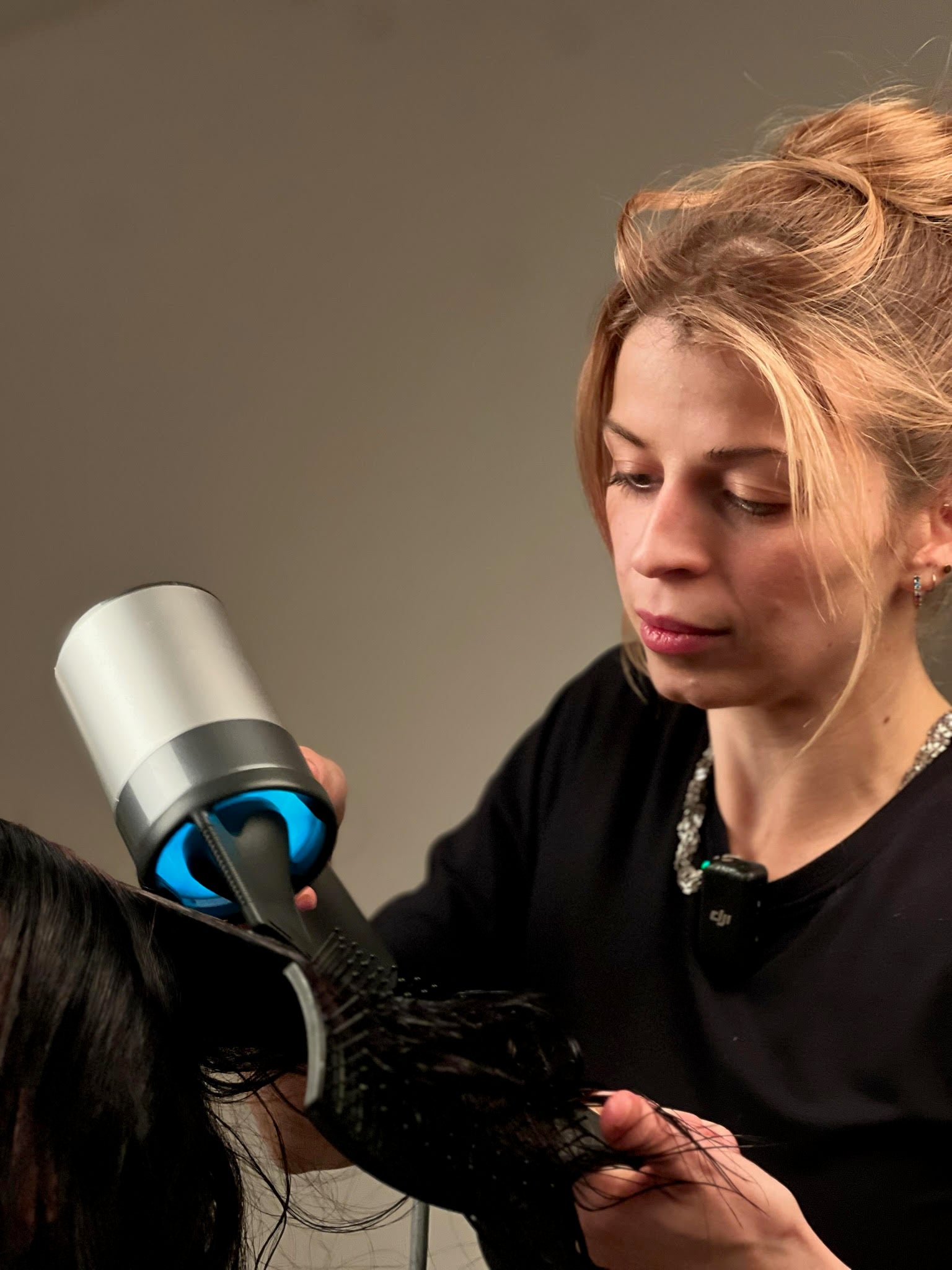 Cassandra Kieffer performing healthy hair styling with a trichology-first approach.